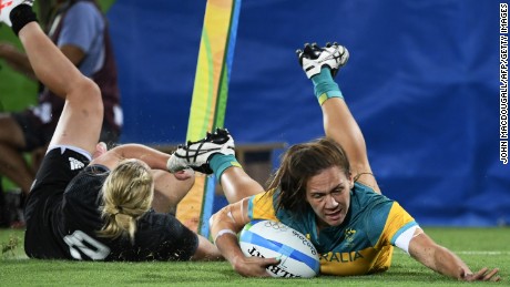 Australia&#39;s Evania Pelite scores a try against New Zealand.