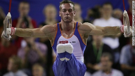 Yuri van Gelder performing on the rings at the 2006 world championships.