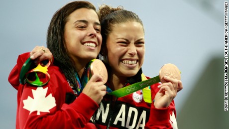 Canadian synchonized divers Meaghan Benfeito and Roseline Filion display their bronze medals. 