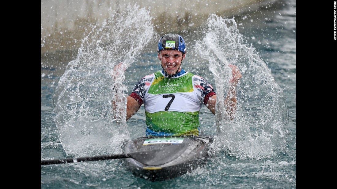 British canoeist Joseph Clarke celebrates after winning the K-1 slalom final.