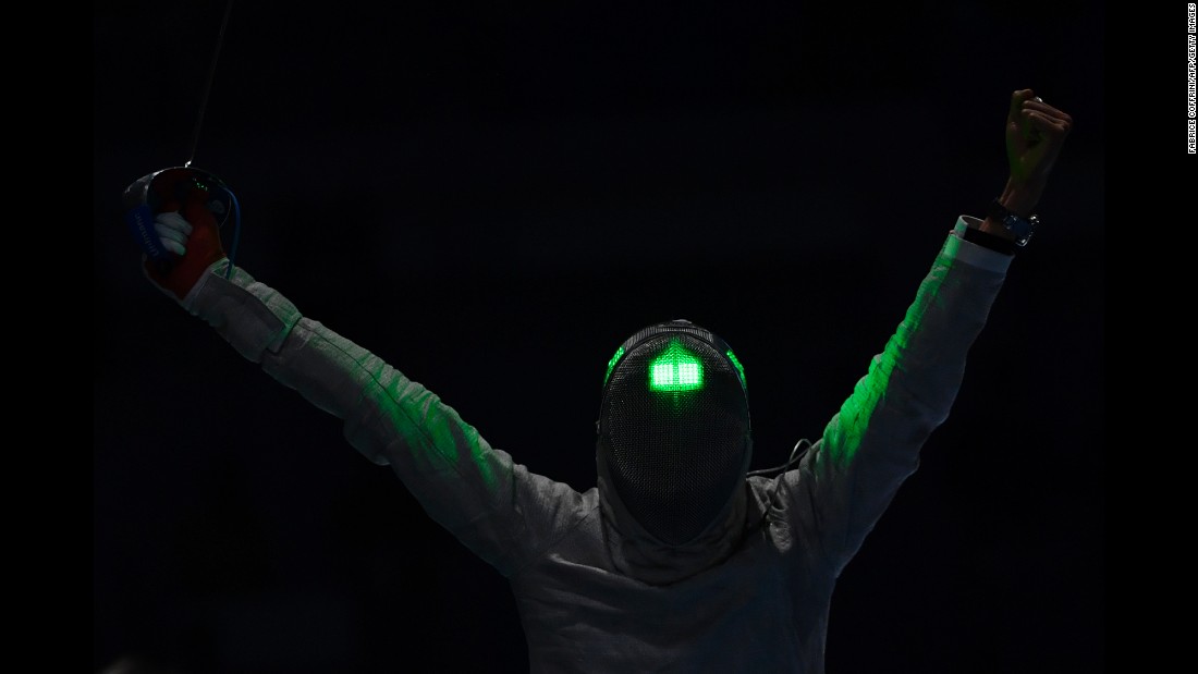 South Korean fencer Kim Jung-hwan celebrates after beating Georgia&#39;s Sandro Bazadze in the men&#39;s individual sabre competition. Kim finished with the bronze medal.