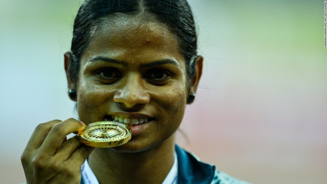 Women with naturally high levels of testosterone (hyperandrogenism) were not allowed to compete in the Olympic Games between 2011 and 2015, until Indian 100m runner Dutee Chand challenged IAAF regulations. Here, Chand poses with her winning medal after victory in the 100 meter race during the Federation Cup National Athletics Championship in New Delhi in 2016.