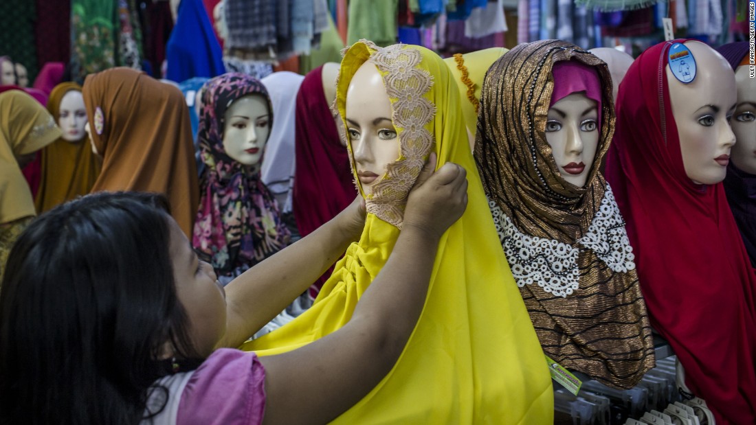 &lt;strong&gt;Hijab:&lt;/strong&gt; The scarf worn tightly around the head and neck does not cover the face. It is the most common Islamic head covering. This Indonesian girl is shopping for a hijab in Yogyakarta.
