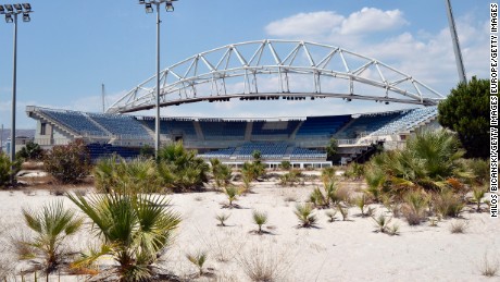 ATHENS, GREECE - JULY 31: General view of the Beach Volleyball Olympic Stadium at Faliro Olympic Complex in Athens, Greece on July 31, 2014. Ten years ago the XXVIII Olympiad was held in Athens from the 13th - 29th August with the motto &quot;Welcome Home&quot;. The cost of hosting the games was estimated to be approx 9 billion euros with the majority of sporting venues built specifically for the games. Due to Greece&#39;s economic frailties post Olympic Games there has been no further investment and the majority of the newly constructed stadiums now lie abandoned. (Photo by Milos Bicanski/Getty Images)