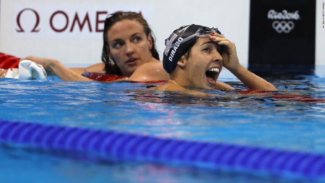 Maya DiRado, right, looks up at her time after winning the 200-meter backstroke. DiRado was trailing Hungary&#39;s Katinka Hosszu, left, for much of the race but edged her at the end. It is DiRado&#39;s second gold medal in Rio.