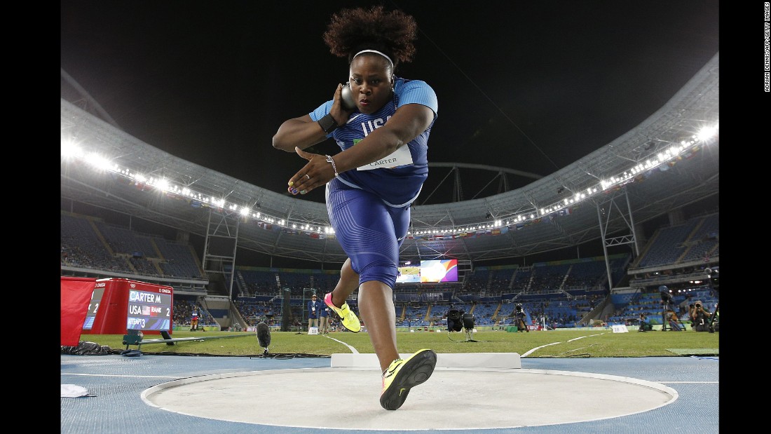 U.S. athlete Michelle Carter competes in the shot put final. She won gold with a throw of 20.63 meters, becoming the first American woman ever to win the event. Carter&#39;s father, former NFL player Michael Carter, won Olympic silver in the shot put in 1984.