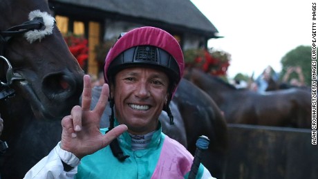 Frankie Dettori celebrates after riding his 3000th British winner on Predilection at Newmarket.