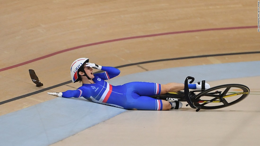 France&#39;s Virginie Cueff reacts after falling in the keirin first round track cycling event.