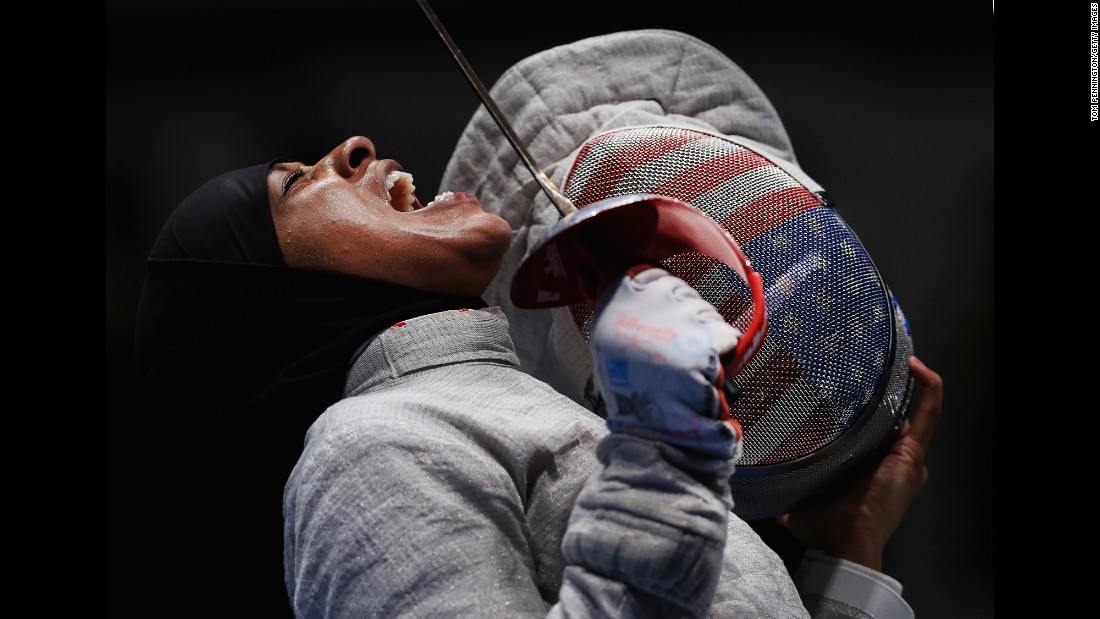 American fencer Ibtihaj Muhammad reacts during the women&#39;s saber team semifinal against Sofya Velikaya of Russia. The US went on to win bronze.