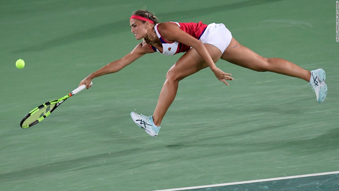 Puerto Rico&#39;s Monica Puig goes for the ball during her singles final tennis match against Germany&#39;s Angelique Kerber.