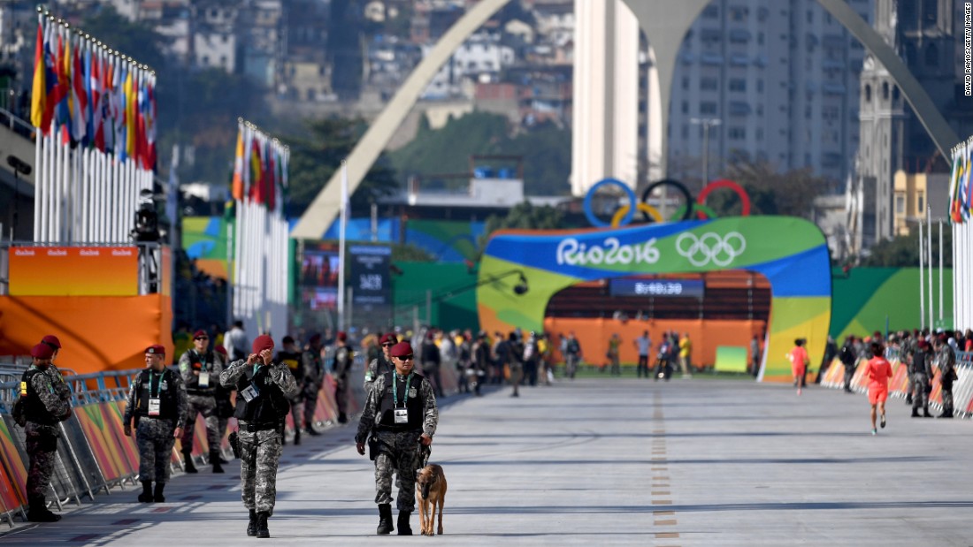 Members of the Brazilian military patrol the course before the start of the Women&#39;s Marathon.