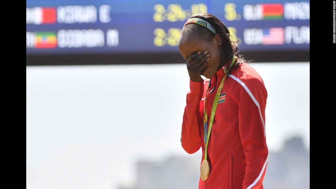 Jemima Sumgong of Kenya becomes emotional during the podium ceremony for the Women&#39;s Marathon on Sunday, August 14. Sumgong is the first woman to win a gold medal in Olympic Marathon running for Kenya.