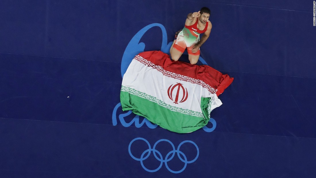 Iran&#39;s Saeid Morad Abdvali celebrates after winning the bronze medal in the men&#39;s Greco-Roman 75 kg competition.