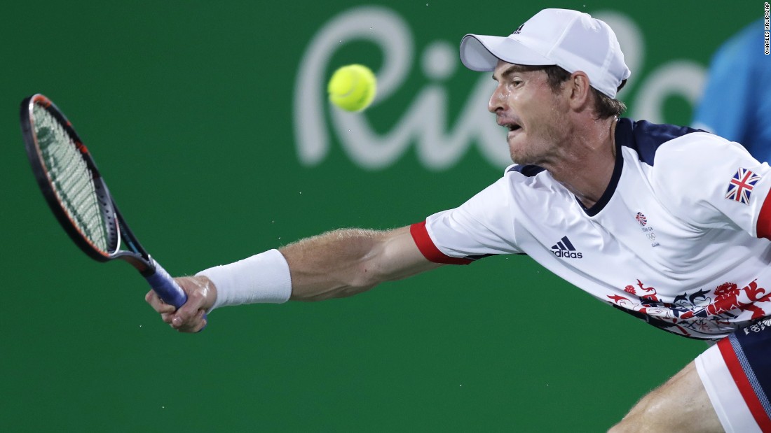 Andy Murray returns to Juan Martin del Potro of Argentina in the men&#39;s tennis final. The British player retained his title.