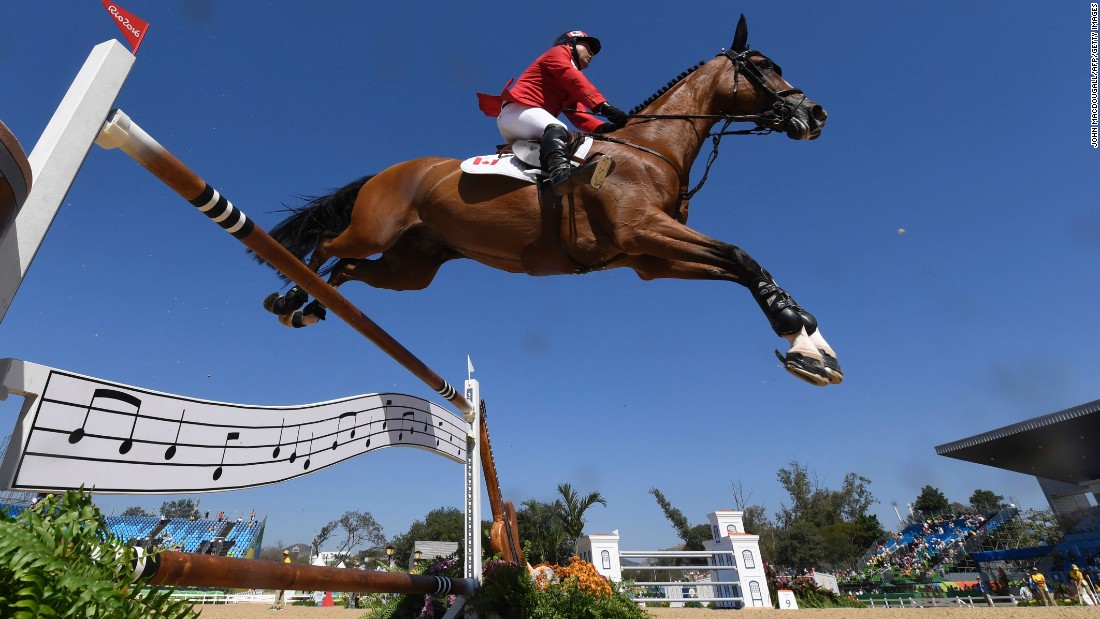 Canada&#39;s Eric Lamaze on Fine Lady competes during the equestrian&#39;s show jumping first qualifier event.