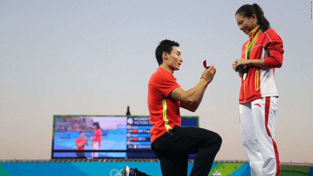 Chinese diver Qin Kai proposes to silver medalist diver He Zhi.