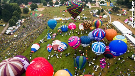 An aerial view of the launch field at Ashton Court shows balloons preparing for the mass lift Sunday