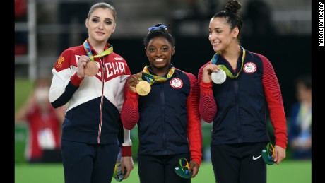 Aliya Mustafina, Simone Biles, and Alexandra Raisman on the medal stand at the 2016 Rio Olympics.