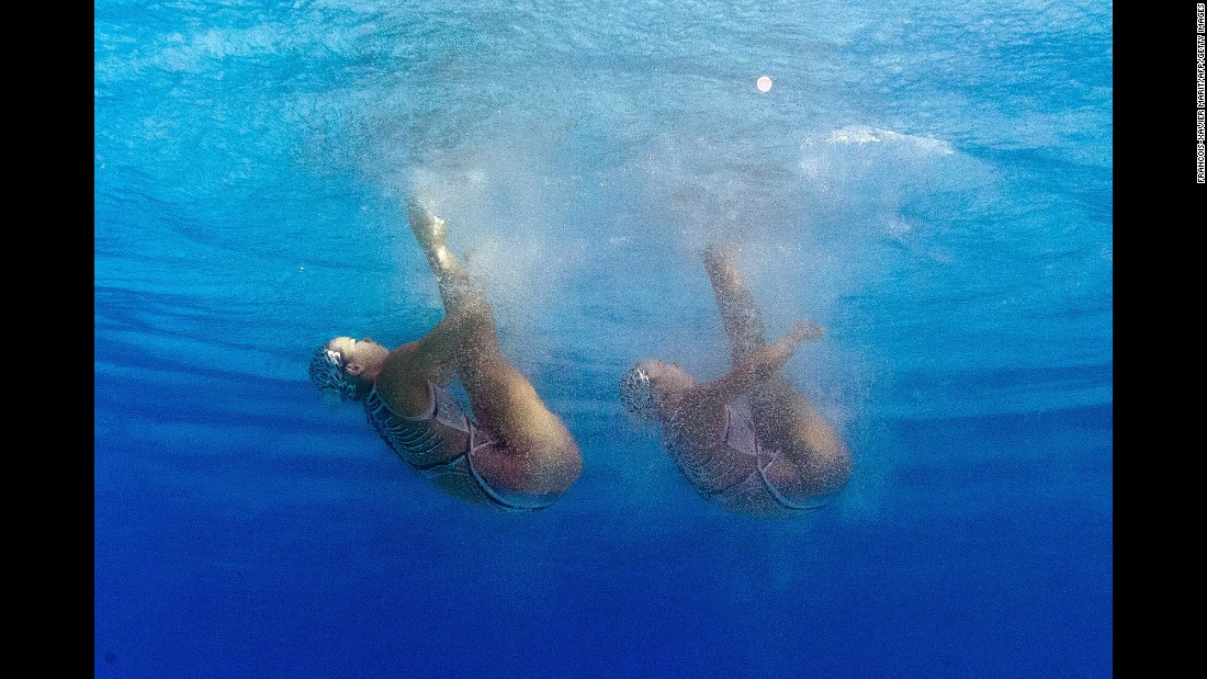 A picture taken underwater shows Chinese synchronized swimmers Huang Xuechen and Sun Wenyan competing in the duets preliminaries.