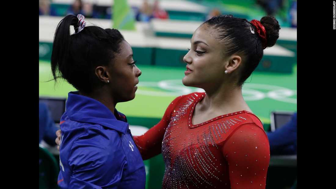 Biles is comforted by compatriot Laurie Hernandez, who got silver on the beam. Dutch gymnast Sanne Wevers won the gold.