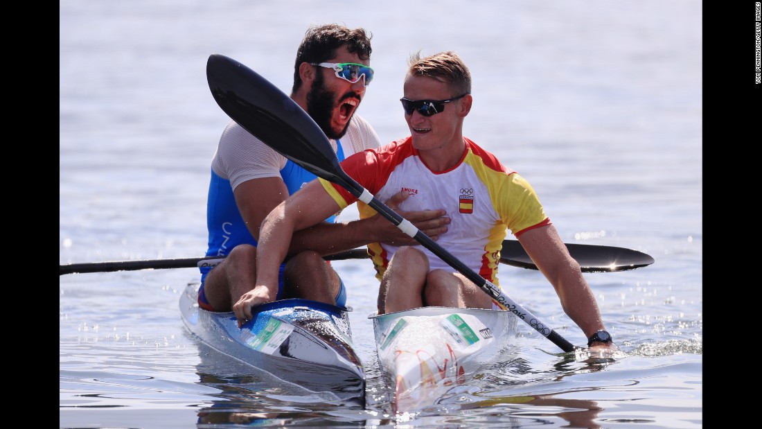 Canoeist Josef Dostal of the Czech Republic, left, celebrates with Spain&#39;s Marcus Walz after the K-1 1,000-meter final. Walz and Dostal took gold and silver while Russia&#39;s Roman Anoshkin earned the bronze.