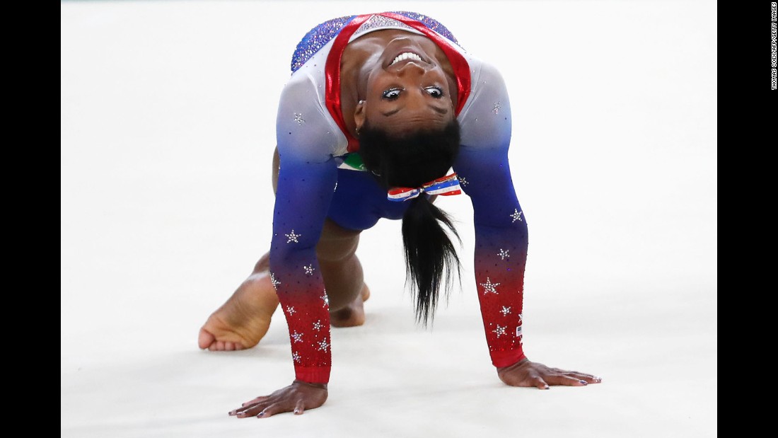 U.S. gymnast Simone Biles competes in the floor exercise. She &lt;a href=&quot;http://edition.cnn.com/2016/08/16/sport/simone-biles-gold-floor/index.html&quot; target=&quot;_blank&quot;&gt;won the event,&lt;/a&gt; finishing this year&#39;s Games with her fourth gold and fifth medal overall. Biles is the first woman to win four gymnastics golds in a single Olympics since Romania&#39;s Ecaterina Szabo in 1984. 