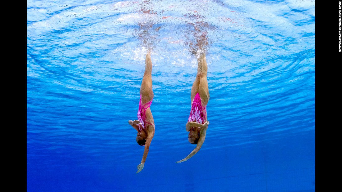 Italy&#39;s Costanza Ferro and Linda Cerruti perform their technical routine during synchronized swimming.