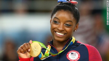 Gold medalist Simone Biles of the United States celebrates on the podium at the medal ceremony for the Women&#39;s Floor on Day 11 of the Rio 2016 Olympic Games, August 16, 2016 in Rio de Janeiro, Brazil.