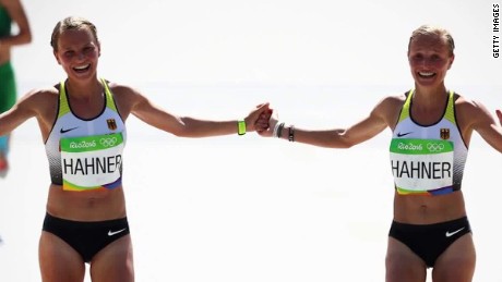 Olympic twins finish race holding hands
