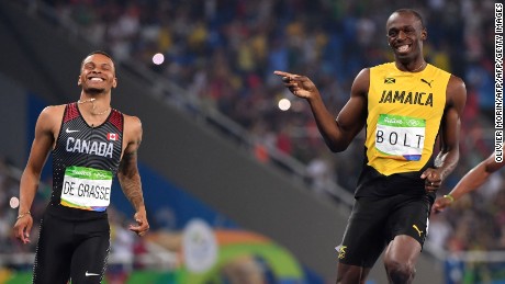 Jamaica&#39;s Usain Bolt (C) jokes with Canada&#39;s Andre De Grasse (L) after they crossed the finish line in the Men&#39;s 200m Semifinal during the athletics event at the Rio 2016 Olympic Games at the Olympic Stadium in Rio de Janeiro on August 17, 2016.   / AFP / OLIVIER MORIN        (Photo credit should read OLIVIER MORIN/AFP/Getty Images)