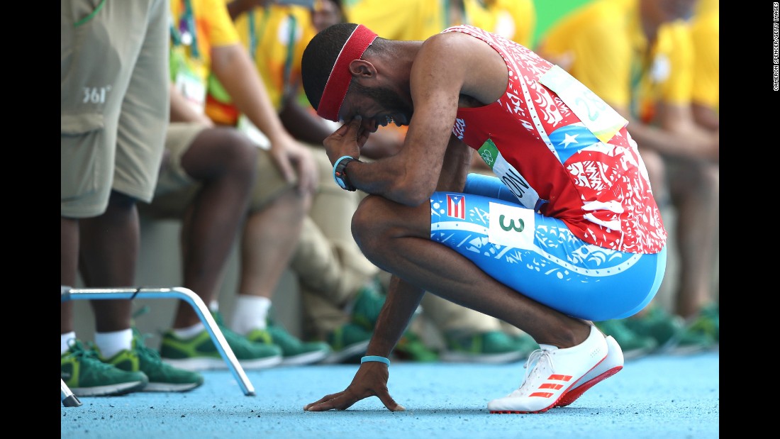 Puerto Rico&#39;s Javier Culson reacts after being disqualified in the 400-meter hurdles final.