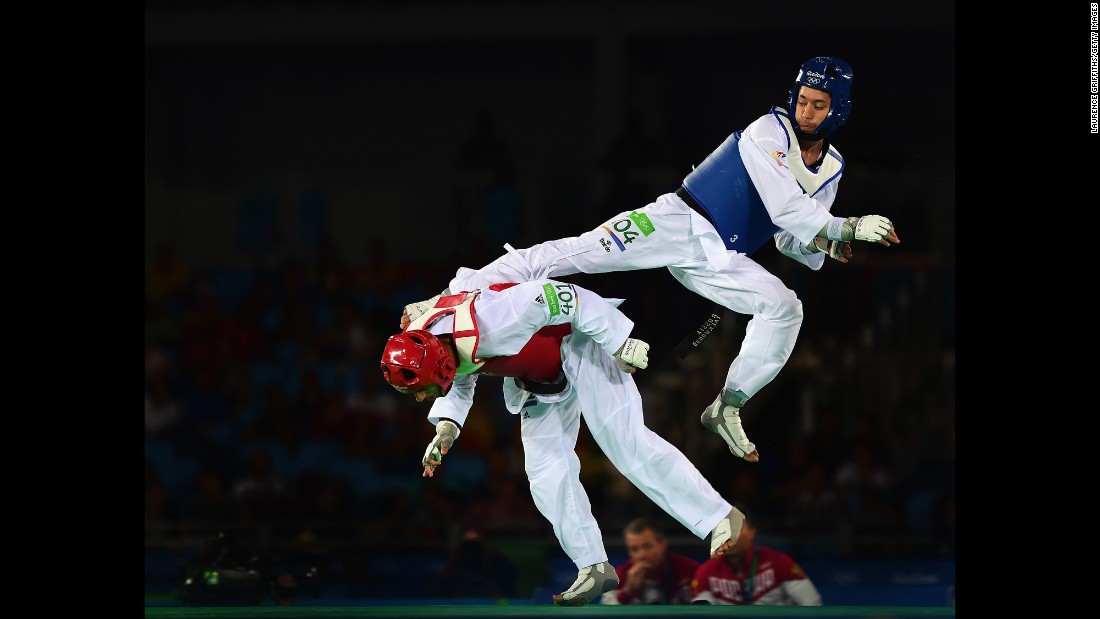 Russia&#39;s Alexey Denisenko kicks Belgium&#39;s Jaouad Achab during a taekwondo semifinal. Denisenko ended up with the silver medal.