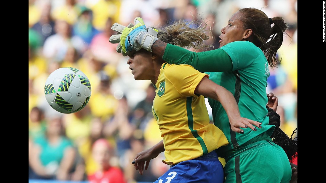 Brazilian goalkeeper Barbara collides with her teammate Monica during the bronze-medal match against Canada. Canada won 2-1.