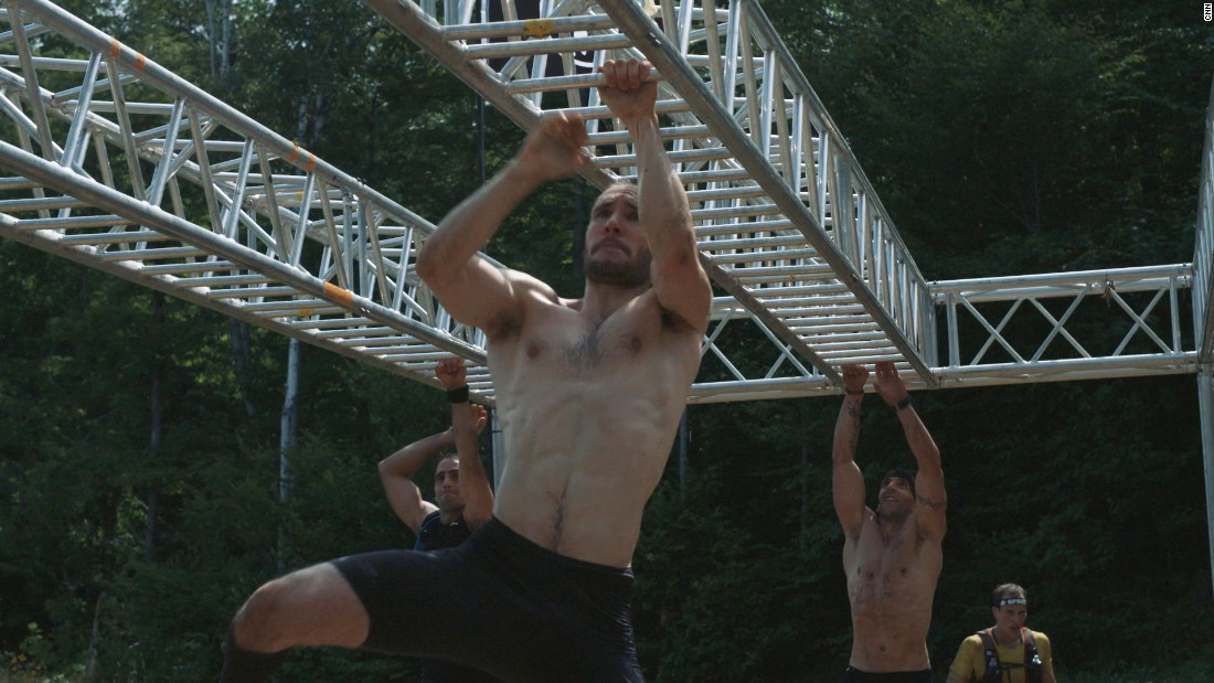 At the end of the monkey bars, the competitors must ring a cow bell before jumping down.