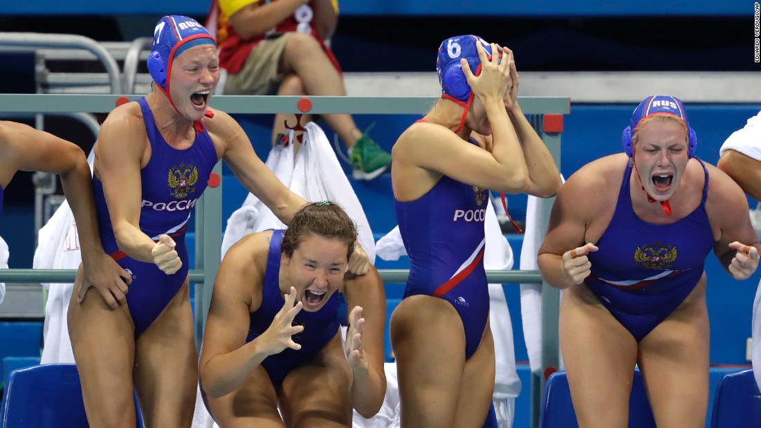 Members of Russia&#39;s water polo team celebrate after defeating Hungary to win the the bronze.