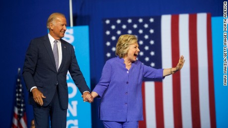 Democratic Presidential candidate Hillary Clinton and US Vice President Joe Biden acknowledge the crowd at Riverfront Sports athletic facility on August 15, 2016 in Scranton, Pennsylvania. 