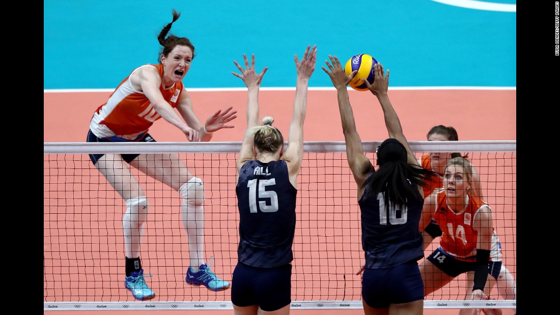 Volleyball players from the Netherlands, in orange, and the United States compete in the bronze medal match. The Americans won.