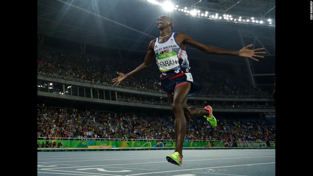 Britain&#39;s Mo Farah crosses the line to win the gold medal in the men&#39;s 5,000-meter final.