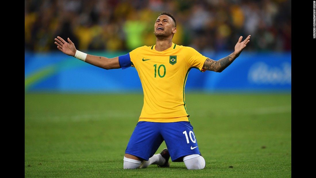 Neymar of Brazil becomes emotional after scoring the winning penalty in a shoot against Germany during the men&#39;s football final.