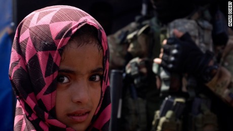 A child in a refugee camp outside al-Qayyara, Iraq, where her family has been living for a month.