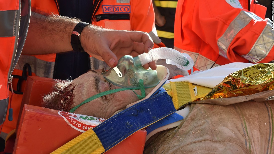 Rocco Girardi receives treatment after being rescued from the rubble in Arquata del Tronto on August 24.