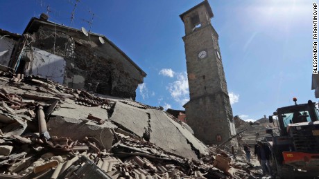 Rescuers search for survivors amidst the rubble following an earthquake, in Amatrice, Italy August 24.