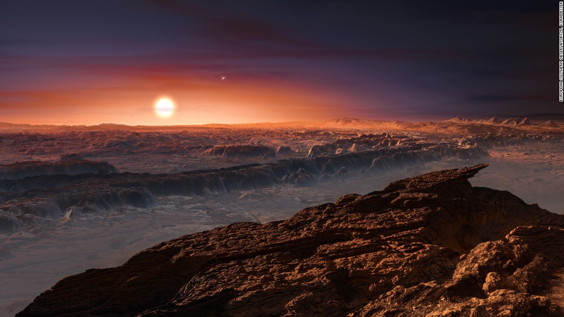 This artist&#39;s impression shows a view of the surface of the planet Proxima b orbiting the red dwarf star Proxima Centauri, the closest star to the Solar System. Proxima b is a little more massive than the Earth.