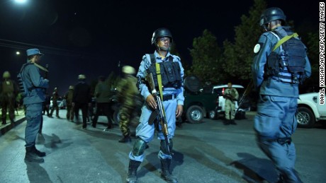 Security personnel stand guard Wednesday night at the American University of Afghanistan in Kabul.
