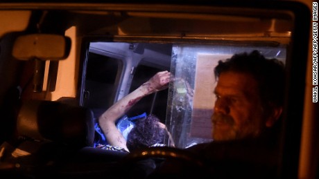 An injured Afghan man lies on a stretcher in an ambulance after Wednesday night&#39;s attack.