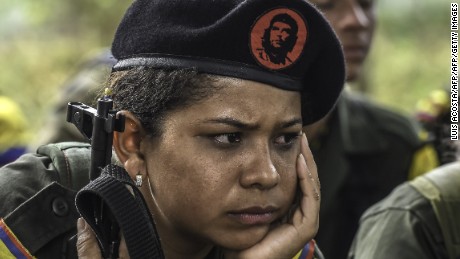 A FARC guerrilla listens during a class on the peace process and how life will be in the future.