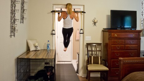 A pull-up bar in the doorway helped her meet her goal.