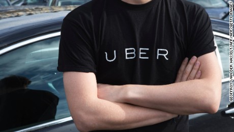 A protester wears a shirt displaying the logo of smartphone ride service Uber during by a protest by non-licensed private hire drivers blocking the Place de la Nation in Paris on February 9, 2016.
Members of services known in France as &quot;voitures de tourisme avec chauffeur&quot; (VTC - Tourism vehicle with driver) have been protesting against assurances the French Prime minister has given to taxis.  / AFP / Geoffroy Van der Hasselt        (Photo credit should read GEOFFROY VAN DER HASSELT/AFP/Getty Images)