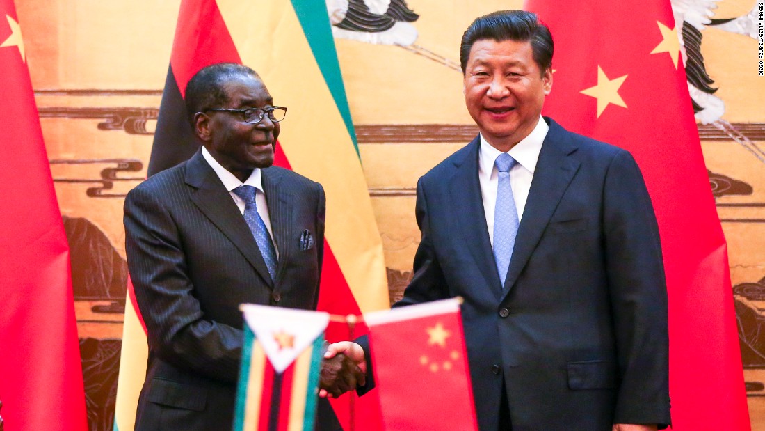 Mugabe and Chinese President Xi Jinping participate in a signing ceremony in Beijing in 2014. 