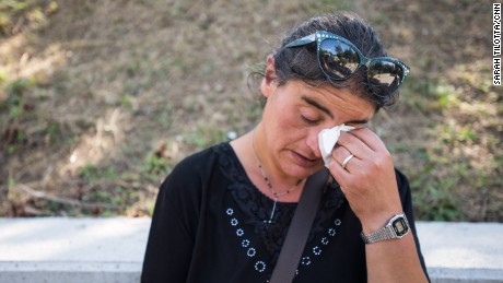 Cecilia d&#39;Alessio takes a moment to grieve for three family members who died in the earthquake in Amatrice. She owns a home in Amatrice city center which she says has now been destroyed. 